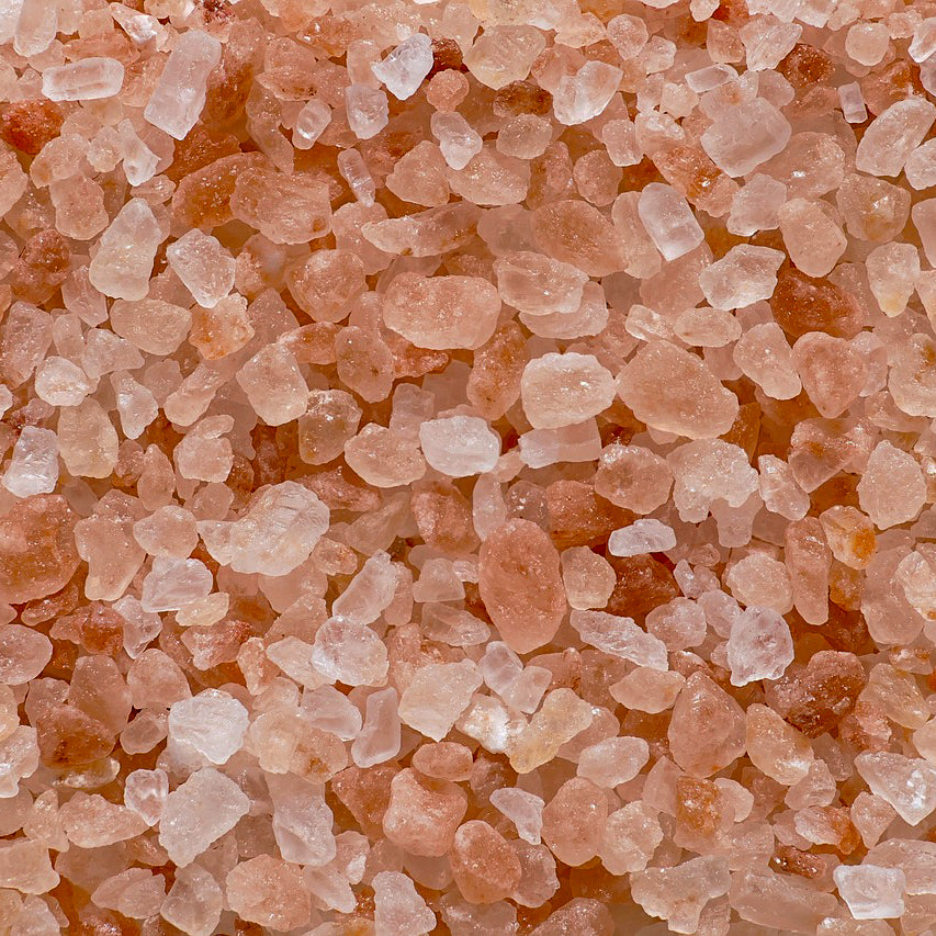 Close-up of Grade A Himalayan Rock Salt crystals (0.3–0.5mm) in shades of pink and orange, sold by Ace Baits as a premium fishing additive.