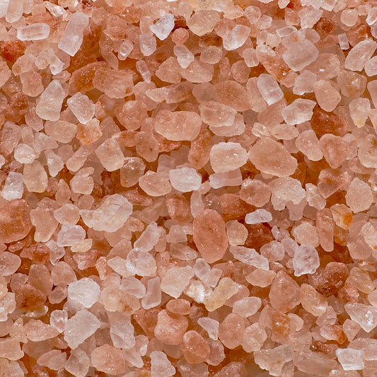 Close-up of Grade A Himalayan Rock Salt crystals (0.3–0.5mm) in shades of pink and orange, sold by Ace Baits as a premium fishing additive.